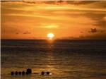 View of the sunset over the beach at JOLLY ROGER RV RESORT - thumbnail
