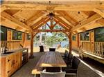 A seating area under a pavilion at PINE ACRES FAMILY CAMPING RESORT - thumbnail