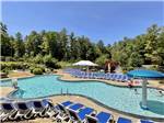 Lounge chairs around the swimming pool at PINE ACRES FAMILY CAMPING RESORT - thumbnail