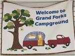 Welcome sign outside main building at GRAND FORKS CAMPGROUND - thumbnail