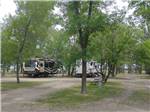 Campsites with parked RVs in distance at GRAND FORKS CAMPGROUND - thumbnail