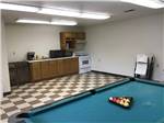 The pool table and communal kitchen at BOOTHEEL RV PARK & EVENT CENTER - thumbnail