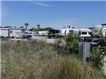 A row of paved RV sites at APACHE FAMILY CAMPGROUND & PIER - thumbnail