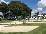 A line of gravel RV sites at ZACHARY TAYLOR WATERFRONT RV RESORT - thumbnail