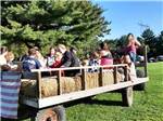 A group of people on a hay ride at COUNTRY ROADS CAMPGROUND - thumbnail