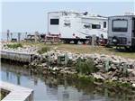 A row of RV sites along the water at FRISCO WOODS CAMPGROUND - thumbnail