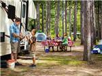 Family camping in RV at YUKON TRAILS CAMPING RESORT - thumbnail