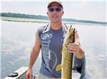 Angler holds up fish he caught at BUFFALO LAKE CAMPING RESORT - thumbnail