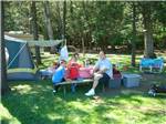 Family camping in tent at FOUR SEASONS CAMPGROUNDS - thumbnail