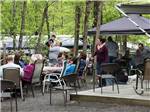 Patio area with picnic tables at FOUR SEASONS CAMPGROUNDS - thumbnail