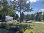 Airstream trailer camping near grassy meadow at HOLIDAY PARK CAMPGROUND - thumbnail