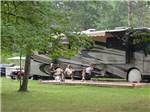 Folks camping in RV at TWIN MILLS CAMPING RESORT - thumbnail