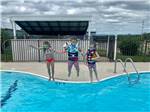 Kids jumping into the swimming pool at OSAGE BEACH RV PARK - thumbnail