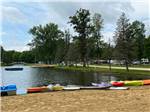 Paddle boats and kayaks next to the water at BER WA GA NA CAMPGROUND - thumbnail