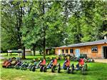 A bunch of pedal carts in front of the game room at BER WA GA NA CAMPGROUND - thumbnail