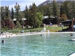People swimming in the large pool at FAIRMONT HOT SPRINGS RESORT - thumbnail