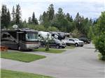 A row of filled RV sites at FAIRMONT HOT SPRINGS RESORT - thumbnail
