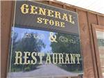 The sign to the general store and restaurant at BISSELL'S HIDEAWAY RESORT - thumbnail