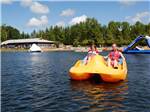 Kids paddle boating at FISHERMAN'S COVE TENT & TRAILER PARK - thumbnail