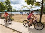 Kids riding on bikes at FISHERMAN'S COVE TENT & TRAILER PARK - thumbnail