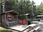 A row of rental cabins with decks at FISHERMAN'S COVE TENT & TRAILER PARK - thumbnail