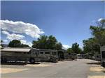 Big rigs parked in paved pads at HIGHLANDS RV PARK - thumbnail