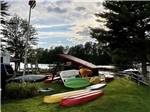 A stack of kayaks near the water at AUGUSTA-WEST LAKESIDE KAMPGROUND - thumbnail