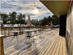The large wooden deck overlooking the pool at AUGUSTA-WEST LAKESIDE KAMPGROUND - thumbnail