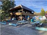 Two-story clubhouse overlooking picnic area at CARIBOU RV PARK - thumbnail