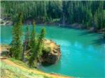 Aerial view of emerald lake with bathers on bluff at CARIBOU RV PARK - thumbnail