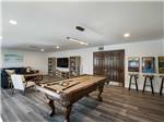 A recreation area with pool table and video games at OCEANSIDE RV RESORT - thumbnail