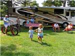 Family camping in RV at BETHPAGE CAMP-RESORT - thumbnail