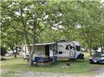 A travel trailer under some trees at SCOTT'S FAMILY RV-PARK CAMPGROUND - thumbnail