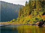 A long dock on the water at REDWOOD MEADOWS RV RESORT - thumbnail