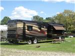 A motorhome in a grassy RV site at SPAULDING LAKE CAMPGROUND - thumbnail