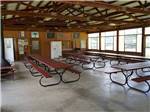 Picnic benches in one of the buildings at SPAULDING LAKE CAMPGROUND - thumbnail