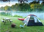 A tent pitched near water and a picnic table at HICKORY RUN CAMPGROUND - thumbnail