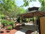 Patio area with table at RANCHO LOS COCHES RV PARK - thumbnail