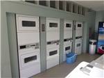 Laundry room with washers and dryers at RANCHO LOS COCHES RV PARK - thumbnail