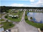 An aerial view of the main road next to the lake at SEVEN SPRINGS TRAVEL PARK - thumbnail