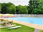 Swimming pool with outdoor seating at SUN VALLEY CAMPGROUND - thumbnail