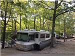 A motorhome in a rustic campsite at BLUE MOUNTAIN CAMPGROUND - thumbnail