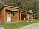 Two of the rustic cabin rentals at WILD BILL'S CAMPGROUND, SALOON & GRILL - thumbnail