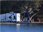 RV sites with trees along the water at SANTEE LAKES RECREATION PRESERVE - thumbnail