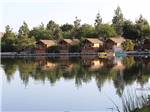 A row of rental cabins along the water at SANTEE LAKES RECREATION PRESERVE - thumbnail