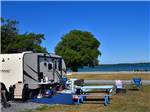 A fifth wheel parked in a gravel site at QUINTE'S ISLE CAMPARK - thumbnail