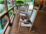 A line of rocking chairs at TWIN CREEK RV RESORT - thumbnail