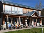 Pedal cars in front of a building at TOBERMORY VILLAGE CAMPGROUND & CABINS - thumbnail