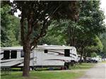 A fifth wheel trailer backed in at WILD ROSE CAMPGROUND & RV PARK - thumbnail
