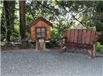 A small library and picnic bench at WILD ROSE CAMPGROUND & RV PARK - thumbnail